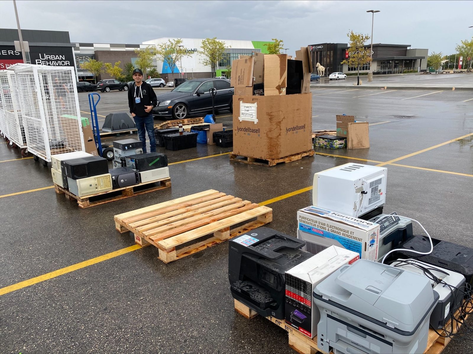 Pallets of collected electronics at a community event