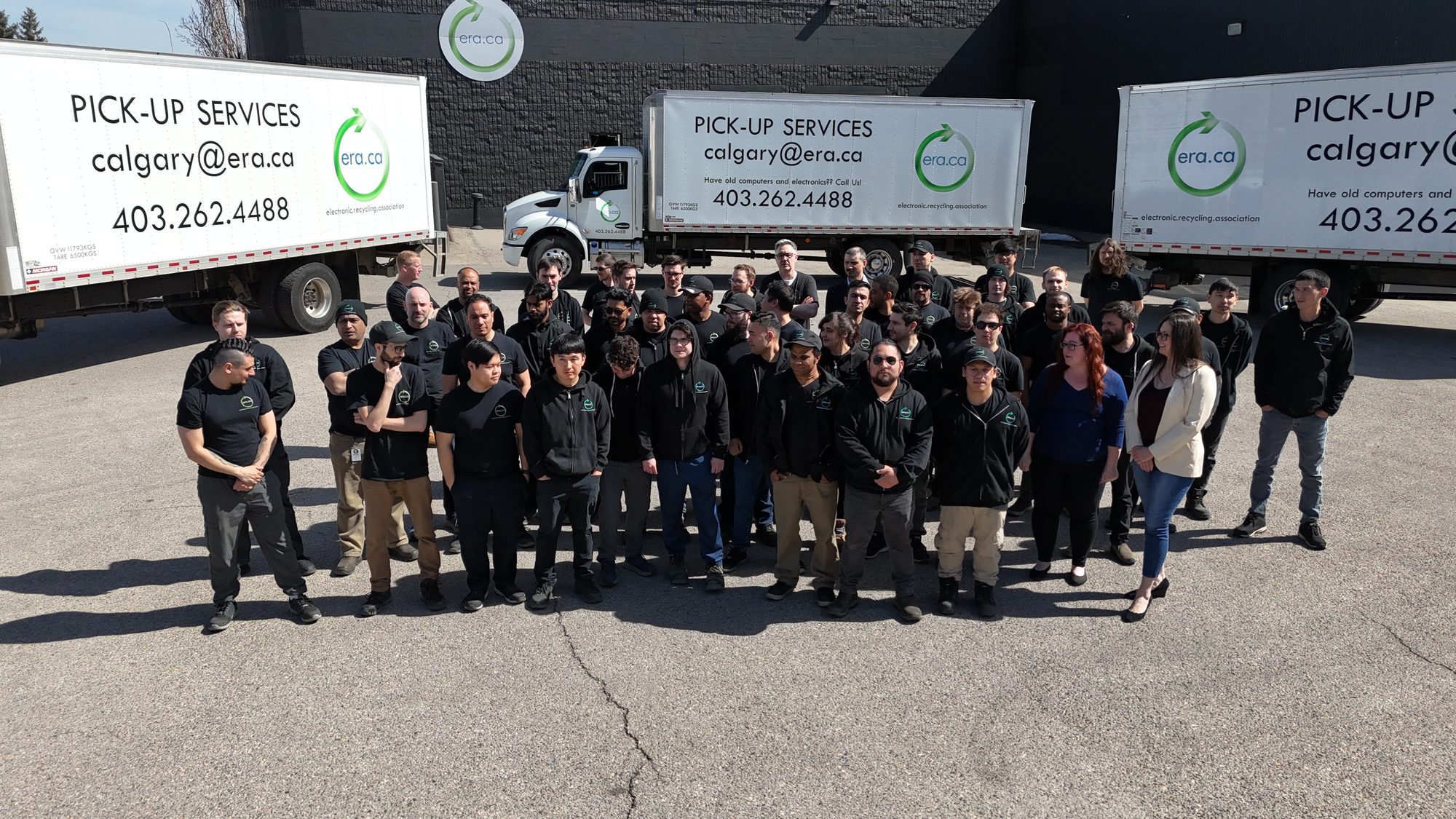 The ERA team beside a collection truck
